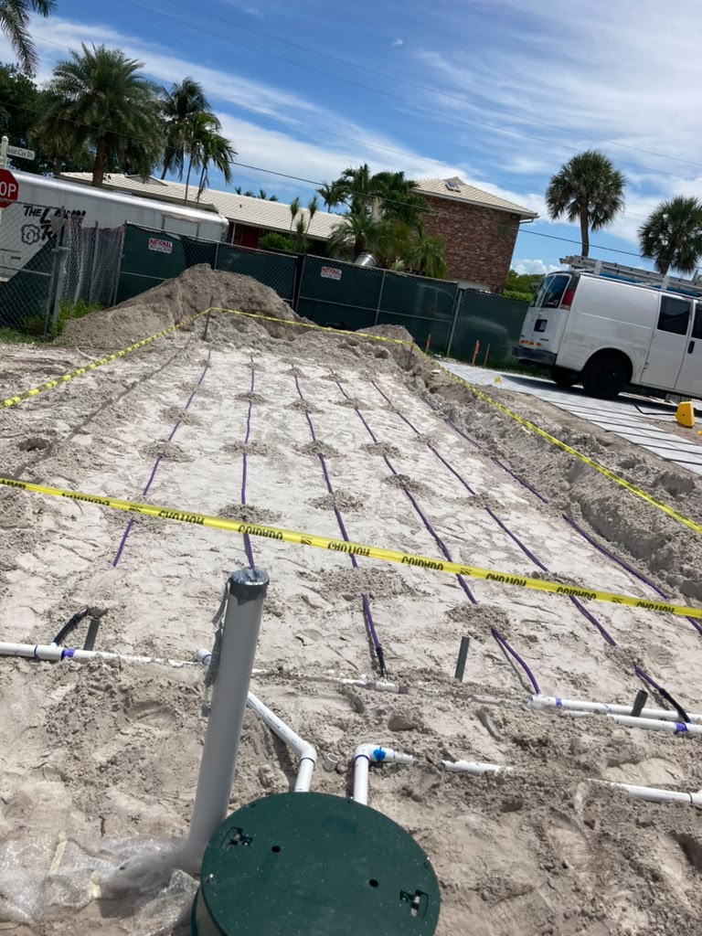 Wrapped drain field rows on a residential site