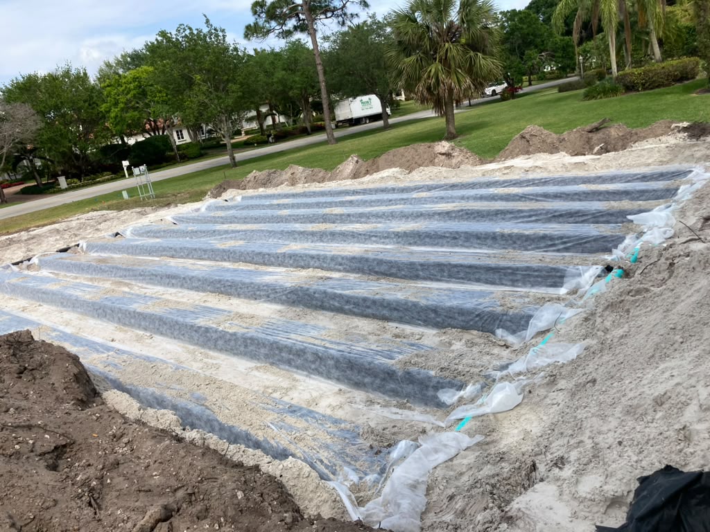 Real CTC SEPTIC drain field rows across a wide sandy site