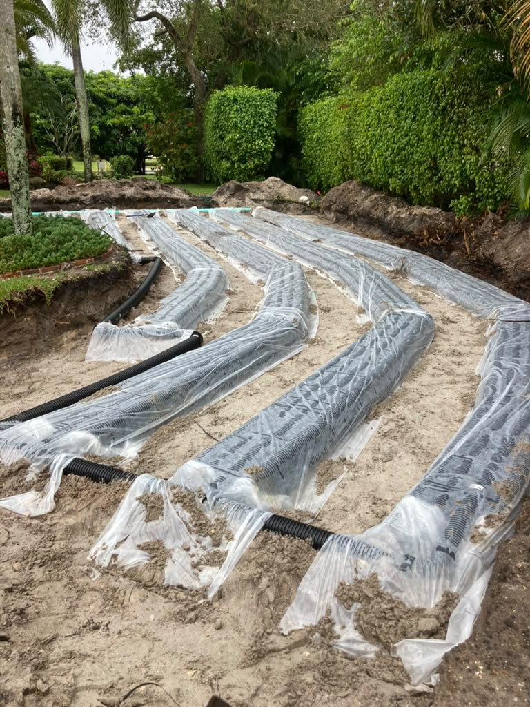 Curved wrapped drain field rows on a property